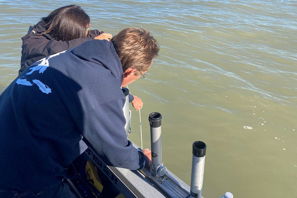 Water sampling along Lake Huron with local landowner participation.